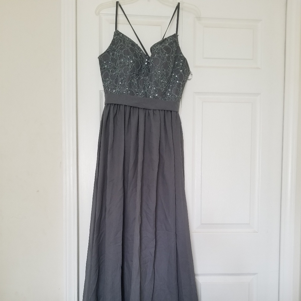 Grey spaghetti strap floor length dress.